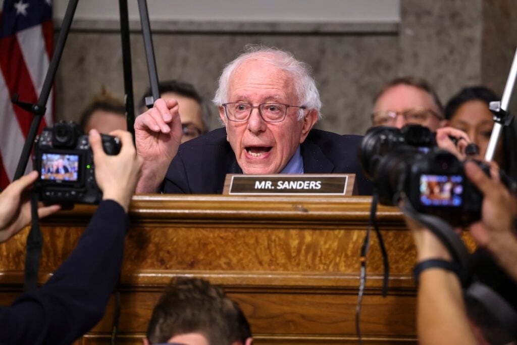 https://images.financialmodelingprep.com/news/bernie-sanders-slams-tesla-palantir-for-not-paying-federal-20260224.jpeg