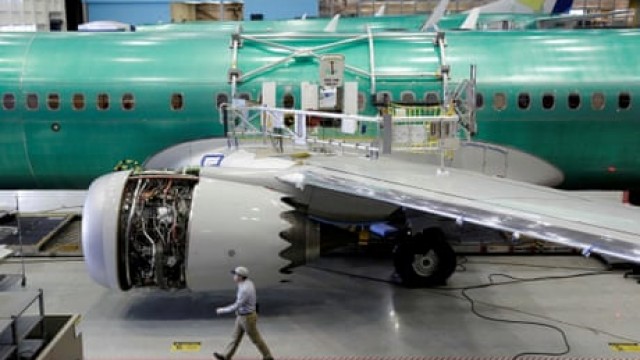 Boeing shareholders vote to re-elect departing CEO to company's board