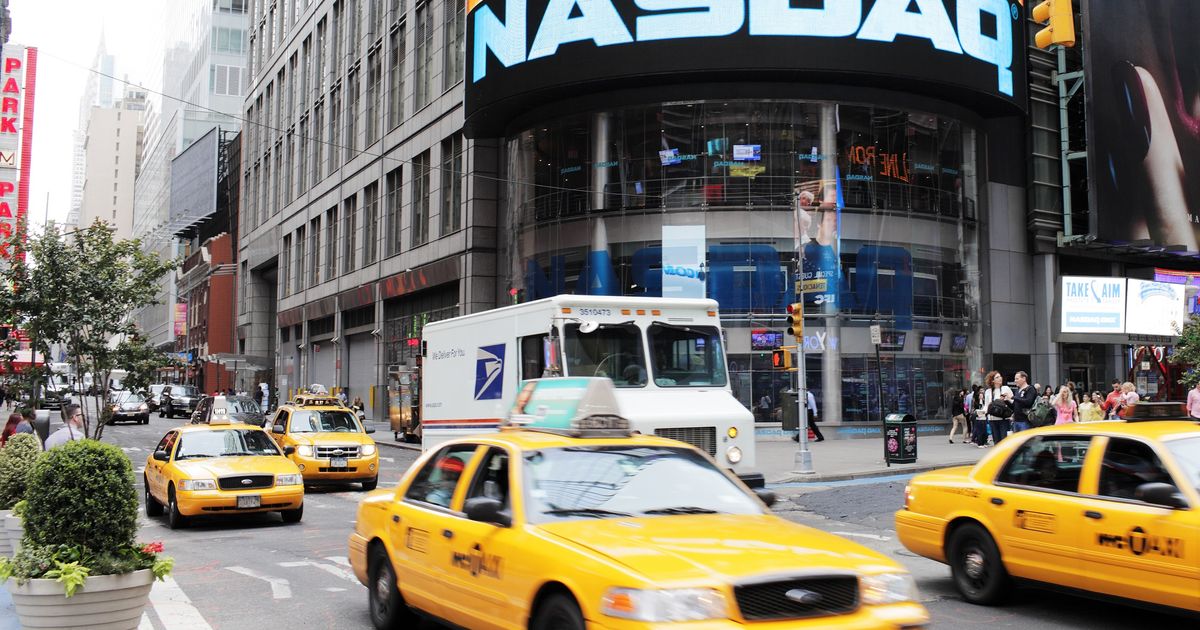 Dow slips, Nasdaq inches higher as earnings keep markets on edge