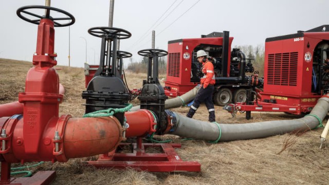 Rain, cooler temperatures help contain wildfire near Canada's oil sands