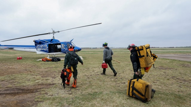 Rain is set to help crews battling blaze near Canadian oil city