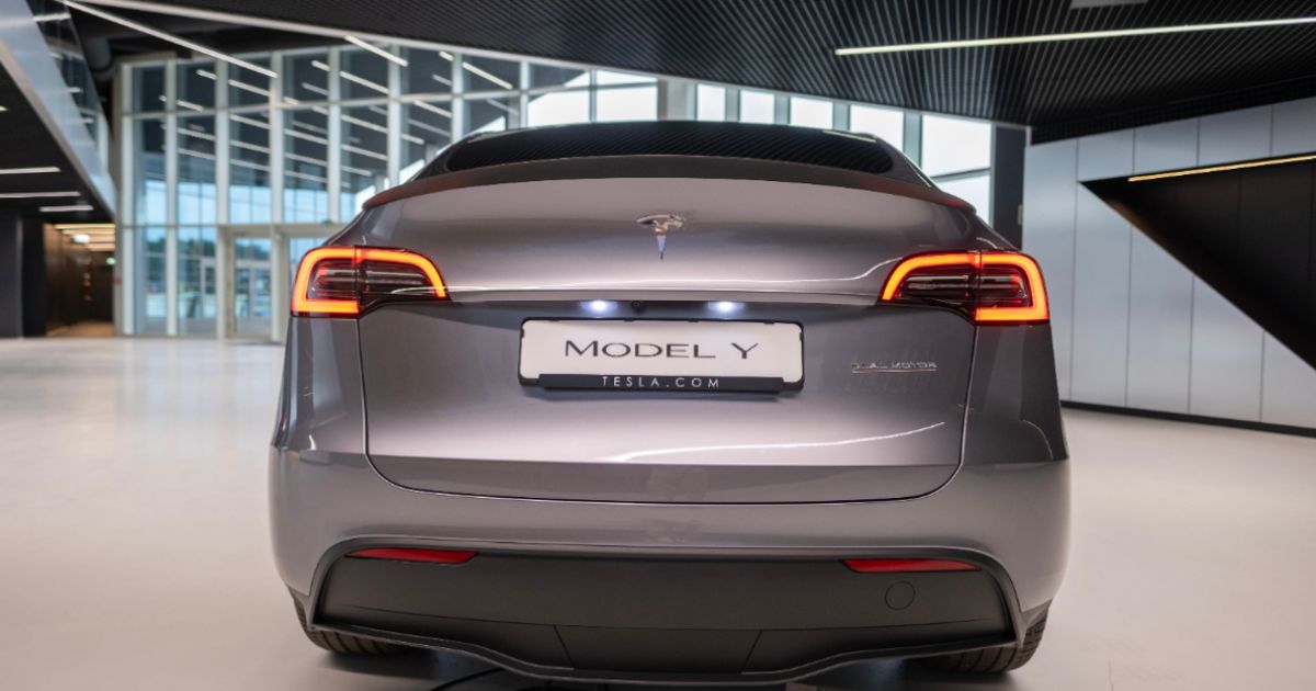 Tesla trims ambitions but bets on autonomy